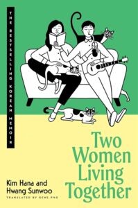 The cover has a cartoon of two women sitting on a couch. One has long hair and holds up a drink to the other's mouth. The other woman has a guitar in her lap and holds a book up to the other's face. There are four cats around them.
