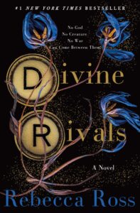 The cover features three blue flowers with gold glitter around them. The D and R for Divine Rivals have gold circles around them.