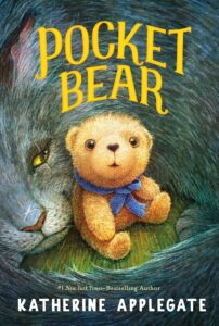 A small yellow teddy bear with a blue scarf. It is surrounded by a gray cat with a scar over its nose and eye.