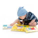Baby reaching for books