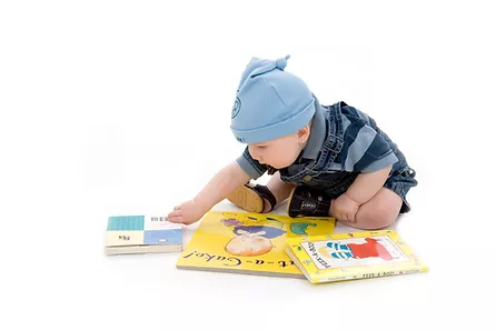 image of baby with books