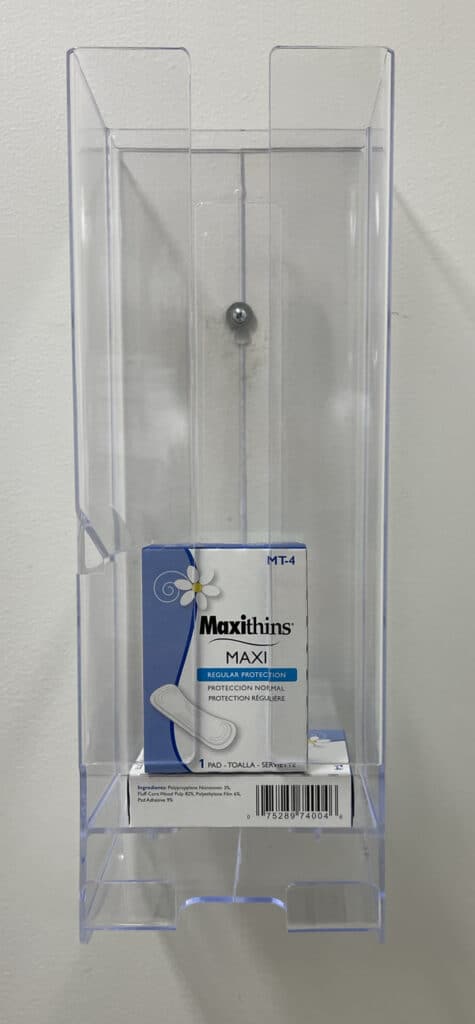 photo of a menstrual product dispenser containing menstrual products