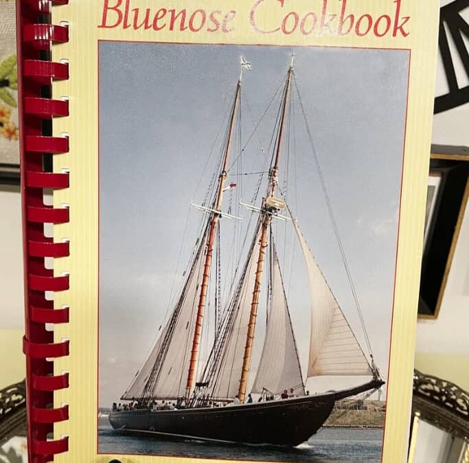image of the cover of Bluenose Cookbook with a photo of the Bluenose schooner