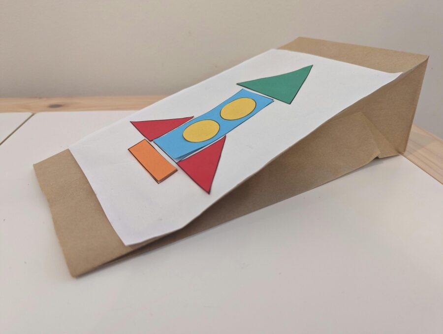 image of a paper rocket on a brown paper bag