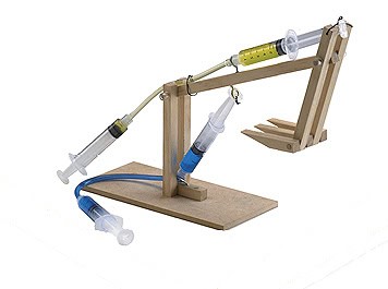 mini-excavator made of wood with syringes to power the hydraulics
