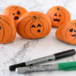 rocks painted to look like jack-o-lanterns