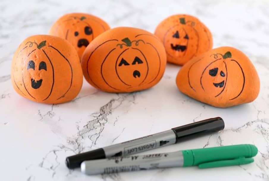 rocks painted to look like jack-o-lanterns