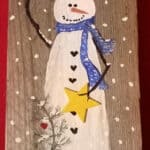 painted snowman on wood.