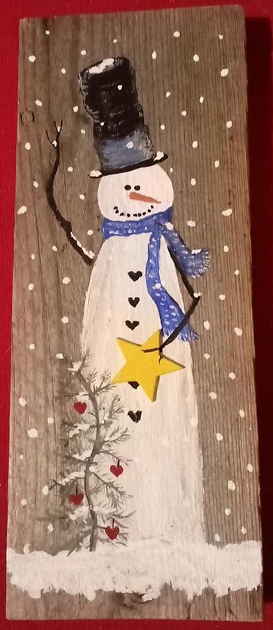 painted snowman on wood.