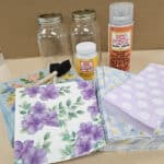 selection of craft material including paper Mason jars and Mod Podge.