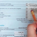 image of a tax form being filled out in pencil