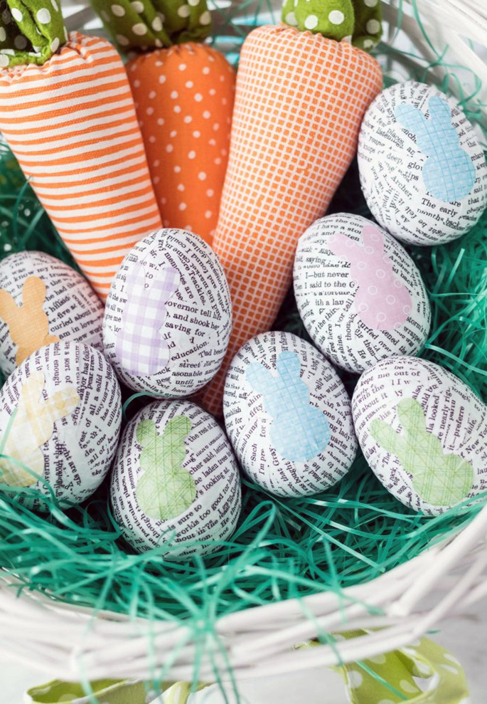 image of paper-covered Easter eggs and knitted carrots in a basket