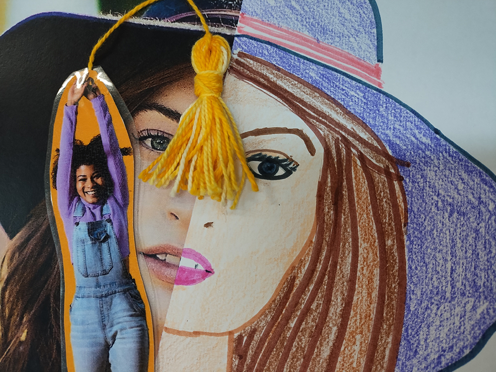 image of a teen in front of a large piece of art of a young girl's face