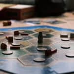 image of the board game Catan with pieces on an octagon-shaped board