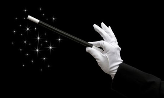 image of a white-gloved hand holding a wand