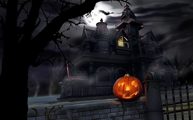 image of a haunted house with an orange jack-o-lantern in front.