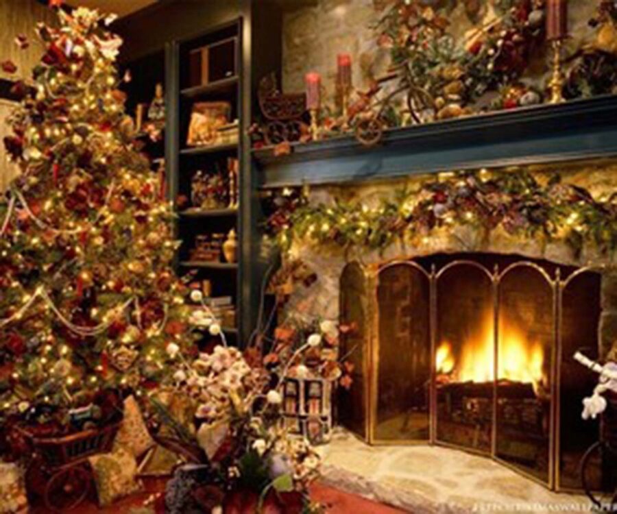 image of a lit fireplace in a living room decorated for Christmas.