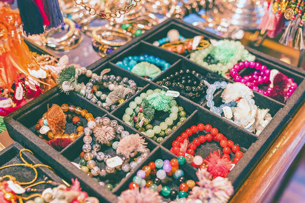 image of many bracelets in a jewelry box on a table.