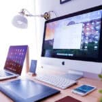 image of a desktop computer, laptop, tablet and smartphone.