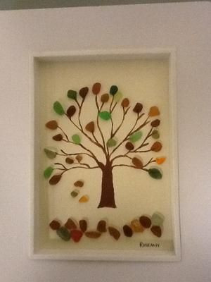 image of a fall tree made of sea glass in a frame.