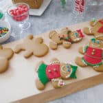image of gingerbread cookies on a wooden cutting board.