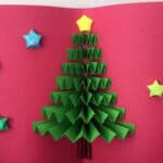 image of a pop-up Christmas card on red paper.