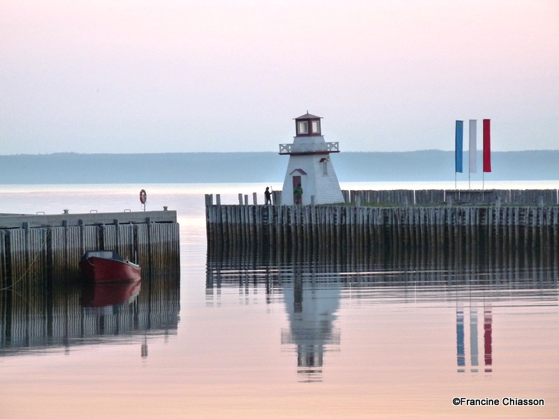 image of a lighthouse on the end of a wharf
