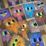 image of many pieces of paper with chalk emu drawings on them.