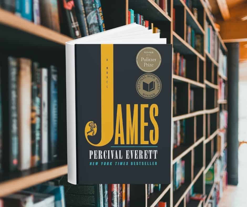 The cover says James but the J is very long and at the bottom of the letter is a sketch of a man with a bindle stick. You cannot see his head. Behind the cover are shelves of books.