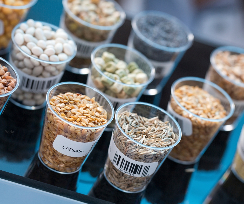 Small clear cups filled with different kinds of seeds.