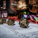 Dungeons and dragons dice are spilled onto a character sheet. A d20 is facing the camera.