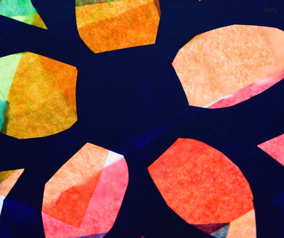 A stained glass window made with coloured tissue paper. It is in the shape of a flower.