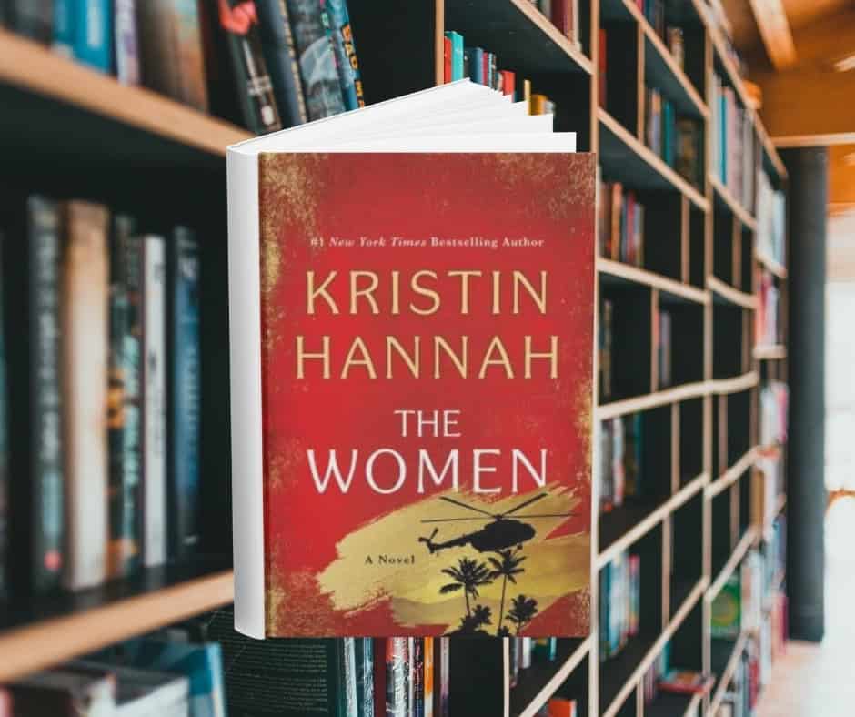 The cover is red and has a blacked out helicopter in the bottom right corner. Behind the cover are shelves of books.